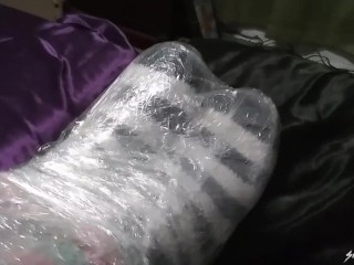 Saran Wrapped Socked Feet