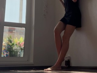 Beautiful leggy barefoot girl changing her panties