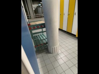 Risky cumshot in public swimming pool changing room!