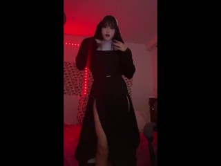 Naughty sexy nun shows her delicious ass in front of the camera and fingers her pussy on the chair i