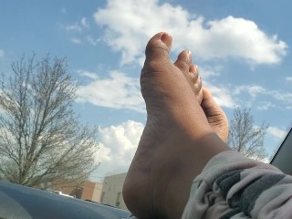 Petite bare feet on a sunny day