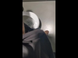 Nerdy guy gets erection in the office toilet