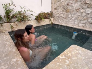 Two hot lesbians masturbate in a public pool, afraid of being discovered.