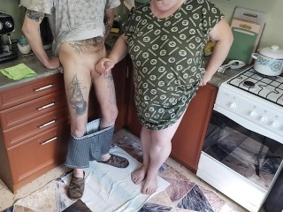 a fat woman jerks off my dick in the kitchen and I cum powerfully