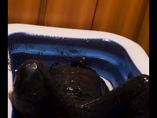 Long shoot of black slime in jeans and boots