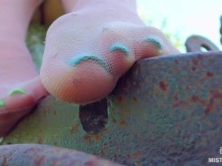 Sexy feet in nylon knee socks and dirty white socks teasing you closeup outdoor