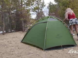 A gorgeous blonde without panties is assembling a tent. For lovers of peeping