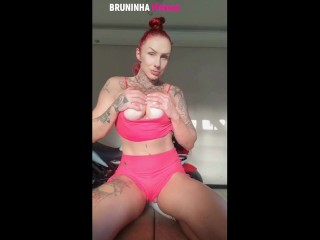 Hot redhead returns from the gym and takes it all off in the sunlight at the window