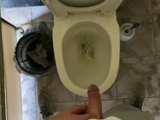 Long pissing of an uncircumcised penis in a public toilet POV