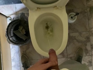 Long pissing of an uncircumcised penis in a public toilet POV