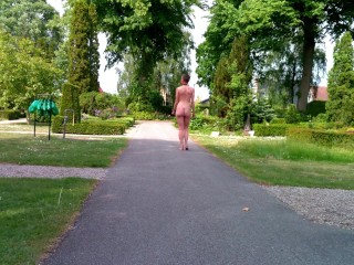 Submissive woman appears nude in public park, masturbation and peeing