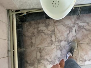 Guy pees in office toilet POV