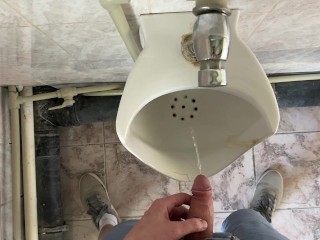 Guy pees in office toilet POV