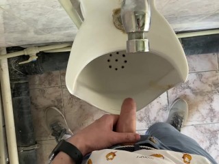 Guy pees in office toilet POV