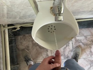 Guy pees in office toilet POV