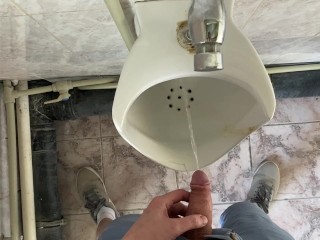 Guy pees in office toilet POV