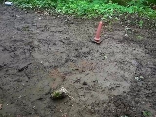 Pet Sissy Sucks a Dildo in the muddy Woods