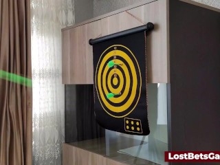 Hot Redhead plays darts with her game and loses the bet