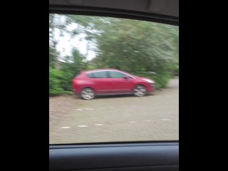 Pissing out of the car in a public car park