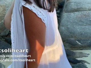 PUBLIC BEACH - naked young woman applying suncream