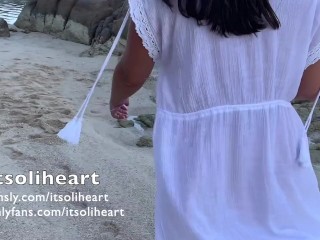 PUBLIC BEACH - naked young woman applying suncream