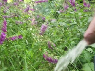 Pissing in the forest with flowers