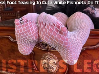 The Goddess in white fishnet tights teasing you with her sexy feet and ass