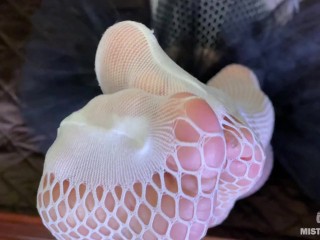 The Goddess in white fishnet tights teasing you with her sexy feet and ass