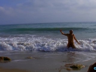 Her pussy is wet when she notices a hung guy coming out of the ocean