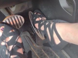 Big feet pedal pumping the gas pedal in strappy sexy black heels