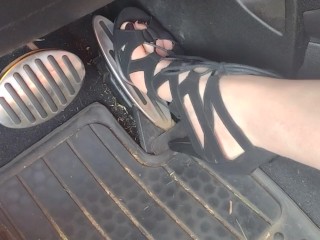 Big feet pedal pumping the gas pedal in strappy sexy black heels