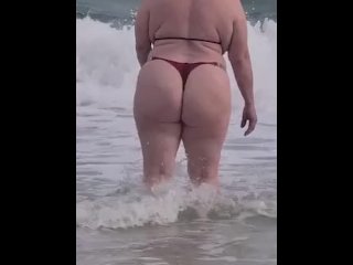 Big booty blonde playing on the beach