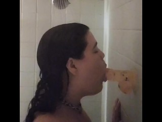 Submissive has fun with a dildo in the shower