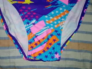 Cumshot in fancy star-printed one piece swimsuit