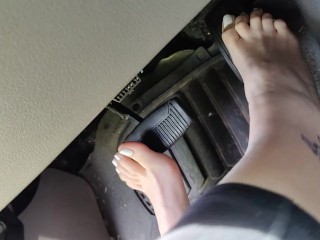 Pedal pumping barefooted in my big truck with white toe nails