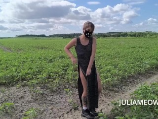 Tattooed girl walks naked in the field