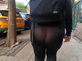 See through leggings with pink thong walking around city