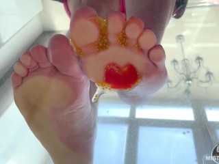 Crush cherry tomatoes with bare feet POV on your face