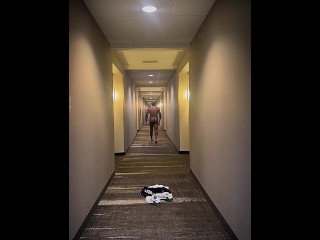 Naked walk down hotel hallway