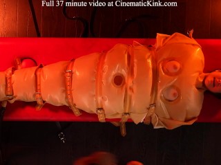 Isabel Love in inflatable latex sack