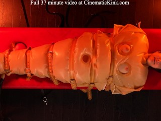 Isabel Love in inflatable latex sack