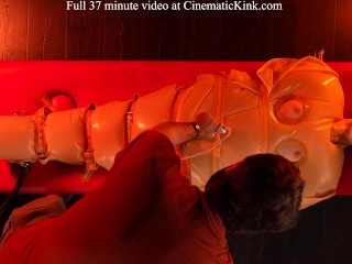 Isabel Love in inflatable latex sack