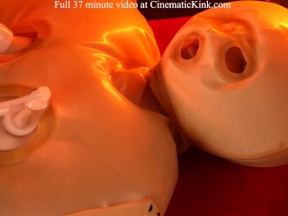 Isabel Love in inflatable latex sack