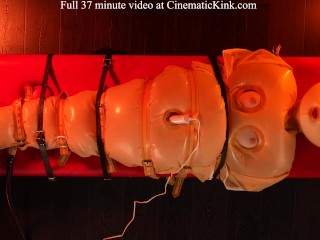 Isabel Love in inflatable latex sack