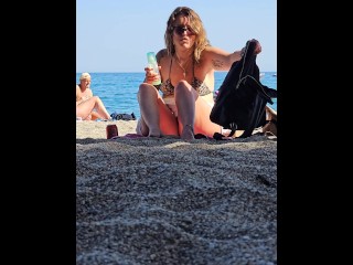 Voyeur video. Public upskirt with no panties on at the beach