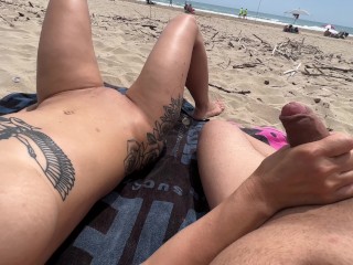 Nudist couple fingering on public beach