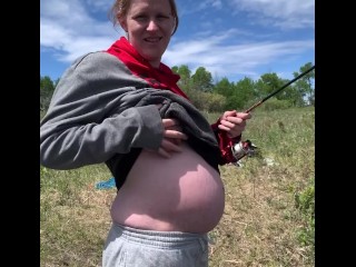 Cute pregnant milf flashes old guys fishing across from her when she sees them staring