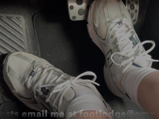 Driving back from the gym in sneakers and white socks