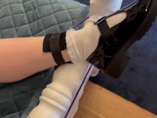 Tied to bed in white socks and Mary Jane shoes