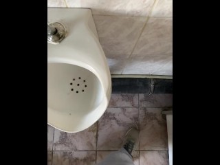 Guy pissing with big uncut cock in public toilet in slow motion POV